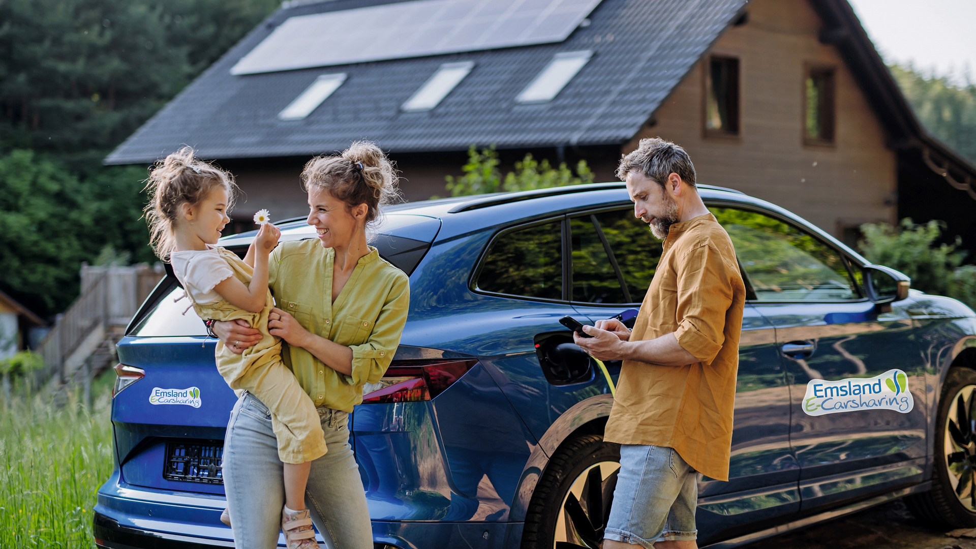 Family with little girl standing in front of their house with solar panels on the roof, having electric car.